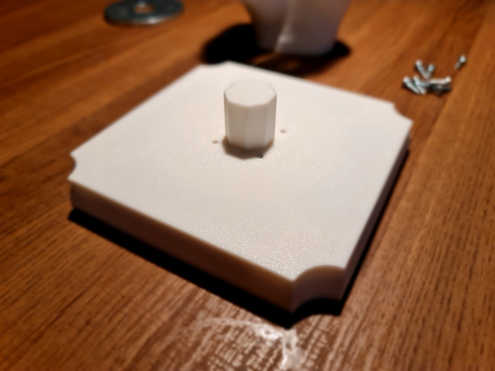 The assembled base with the peg sticking out of the top