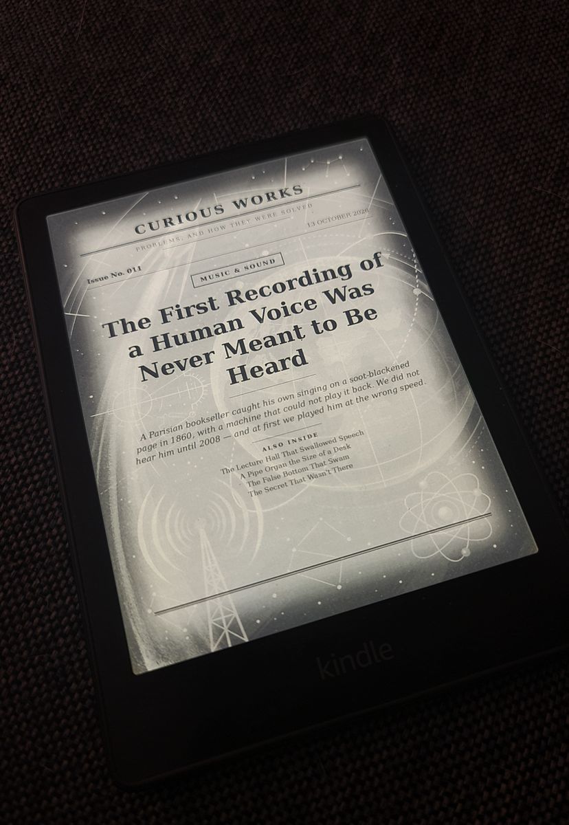 A Kindle showing the cover of Curious Works Issue No. 011, a Music & Sound issue titled The First Recording of a Human Voice Was Never Meant to Be Heard, with an illustrated cover